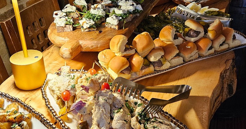 Party food spread with sliders and bruschetta