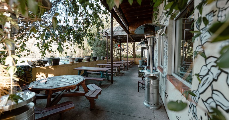 Exterior space, patio with wooden table bench sets
