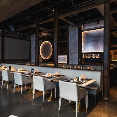 Dining area, tables with banquette seating.