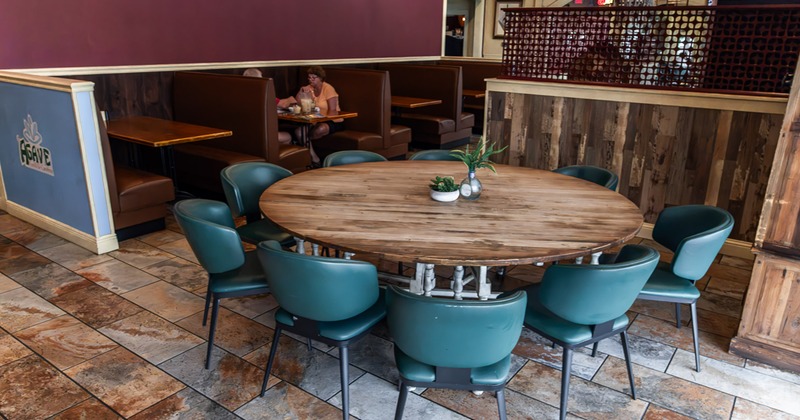 A large round table for nine guests
