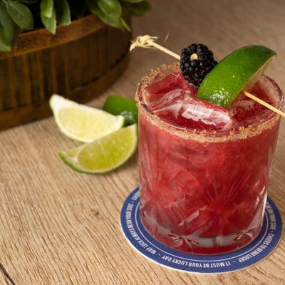 A served blackberry margarita.