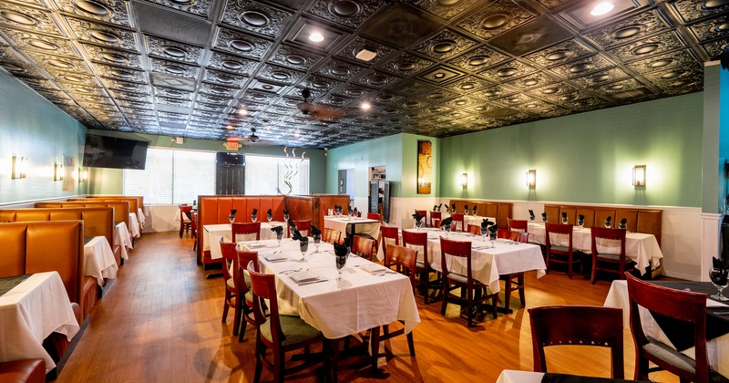 Spacious interior dining area with set tables ready for guests
