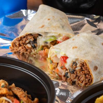 Beef burritos,  with cheese, lettuce, and pico de gallo.