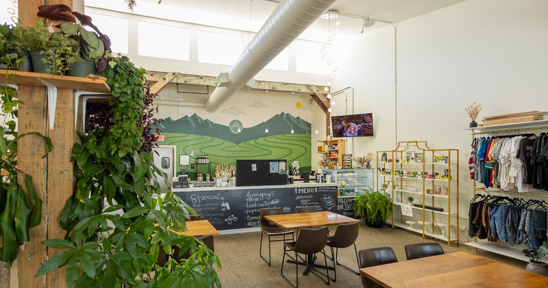 Cozy industrial-style cafe interior seating area and order counter