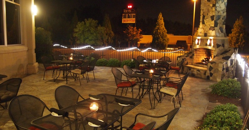 Exterior seating area with chairs and tables
