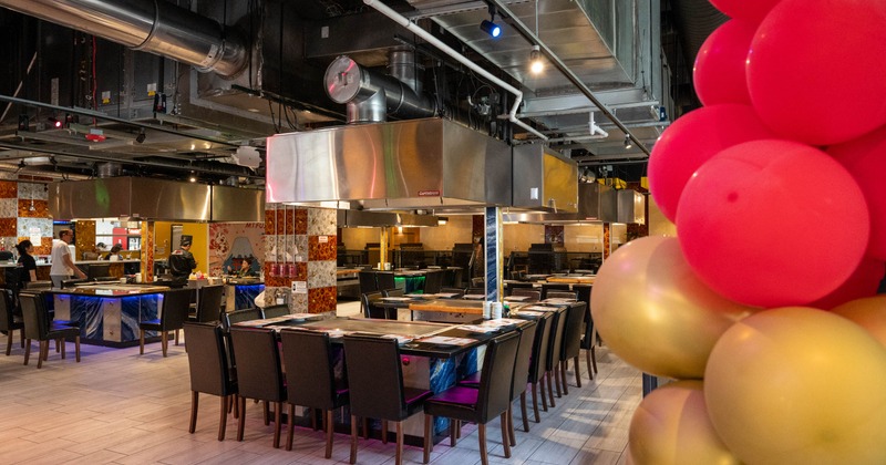Interior, wide view, dining area, tables and chairs ready for guests