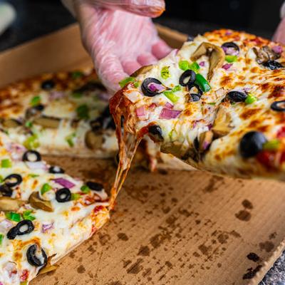 Sliced Veggie Delight pizza.