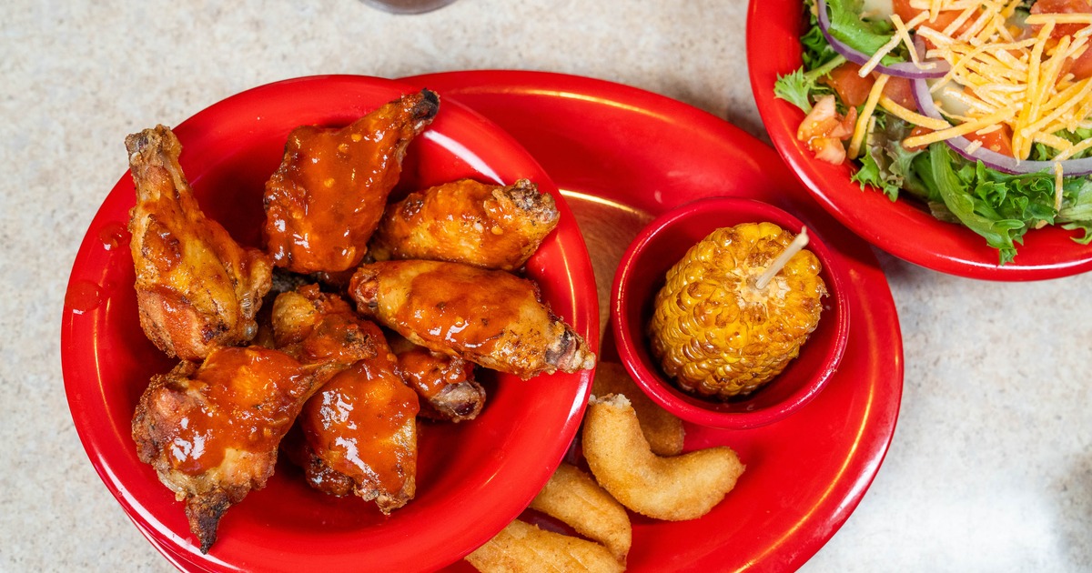 Plate of chicken wings served with sides