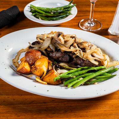 Grilled New York Strip Steak, with grilled onions, mushrooms, green beans, and potatoes.