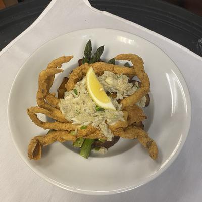 Crab on Crab--fried jumbo soft shell crab topped with crabmeat served on a bed og asparagus & new potatoes.