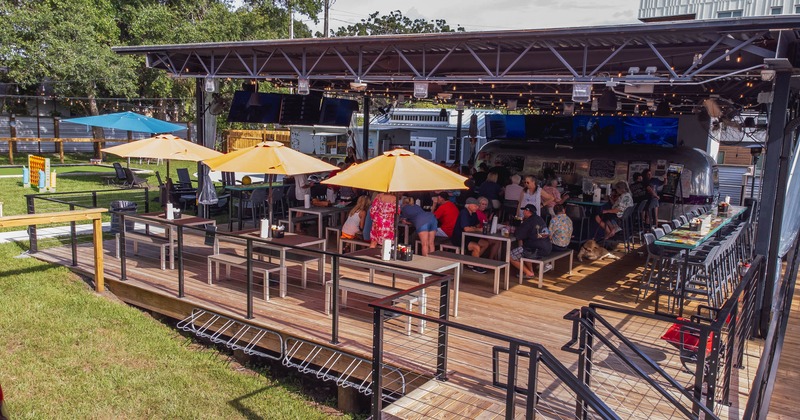 Roof covered seating with a bar