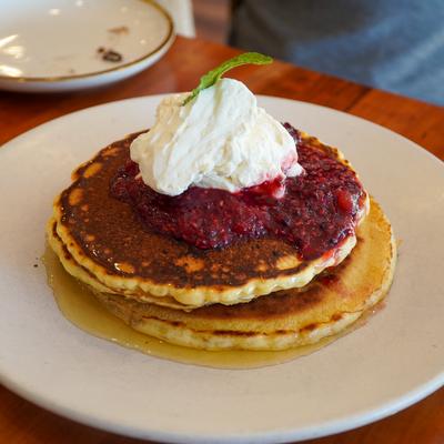 Pancakes with fruits and cream.
