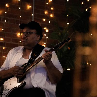 A guitarist during live music performance.