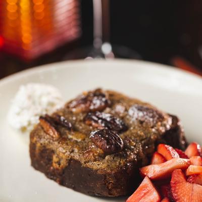 French toast, with whipped cream and strawberries.