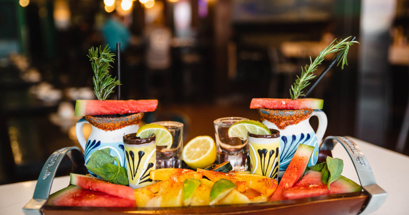 Fruit platter served with shots