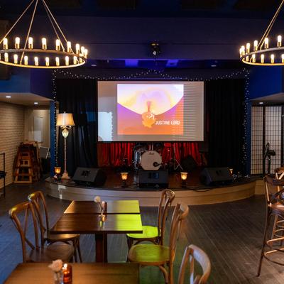 Interior, seating area in front of a stage.