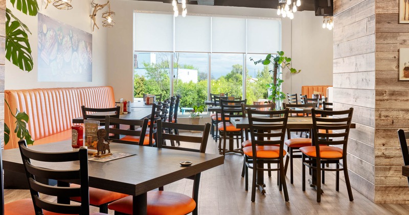 Interior, dining area with large window in the back