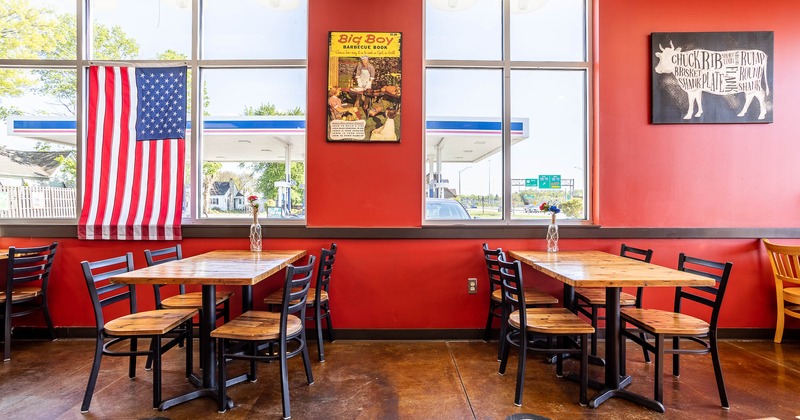 Interior, two tables for four by the windows