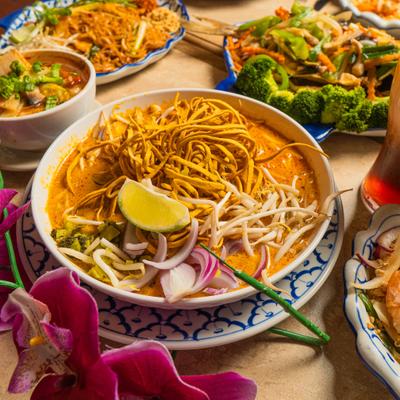 Thai coconut noodle soup topped with crispy egg noodles and bean sprouts.