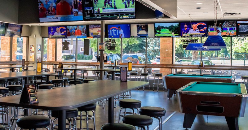 Interior, barstools, tables, pool table, TVs