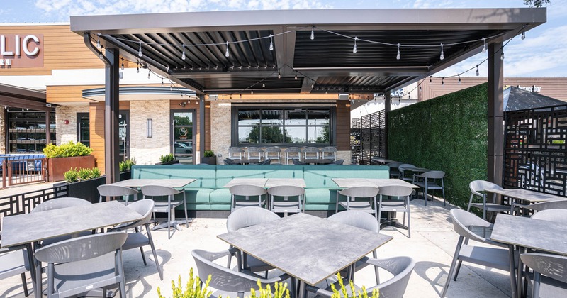 Exterior, patio with a covered and open part, tables and seating