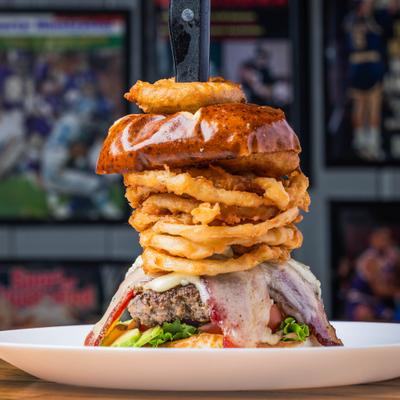 Bacon cheeseburger with onion rings.