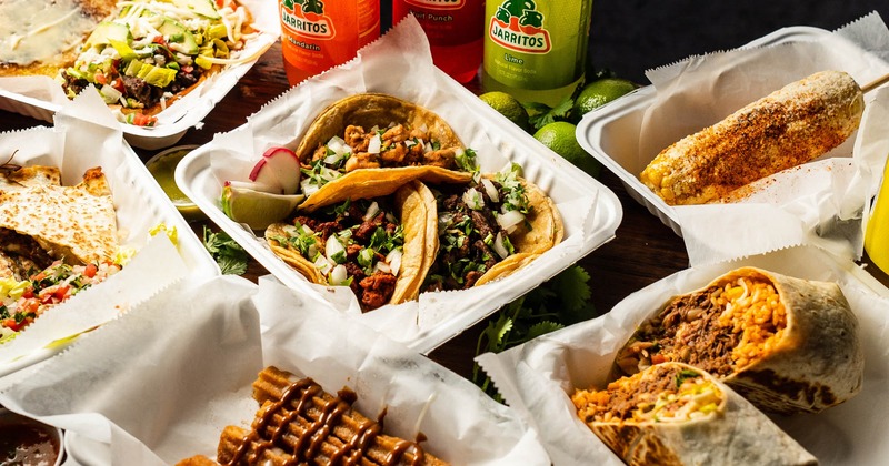 Table spread with various types of dishes and beverages