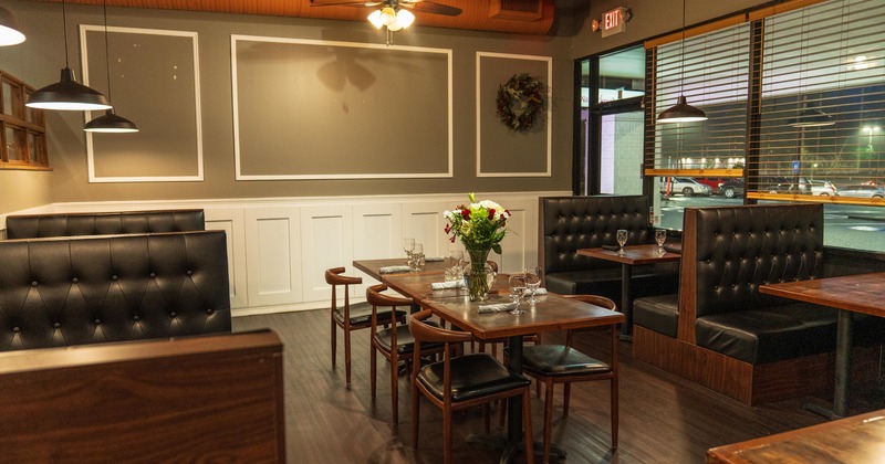 Leather seating booths and tables with chairs