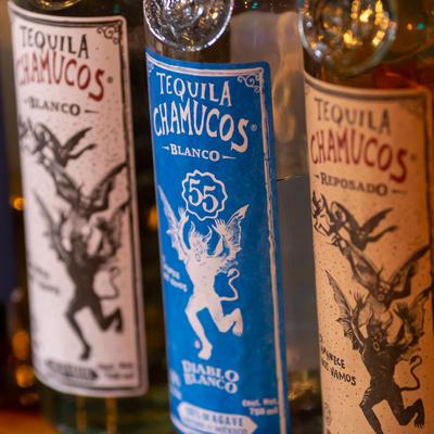 Tequila brands on bar shelf, closeup