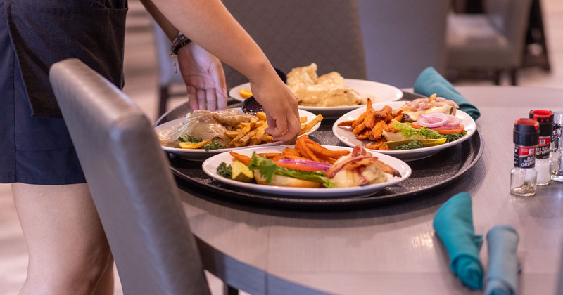 Staff member serving food