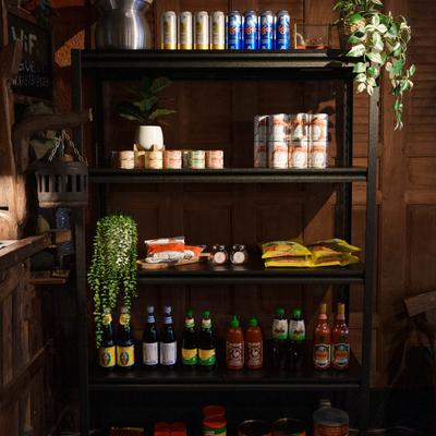 Shelves with bottled drinks and packed goods.