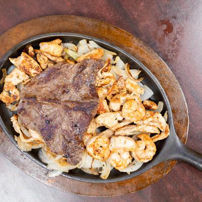 Food in pan served on the table.