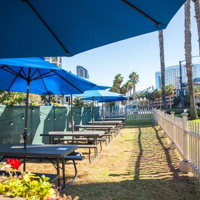 Outdoor seating area, picnic tables.