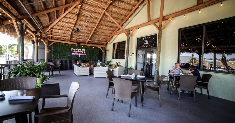 Covered patio with tables and chairs