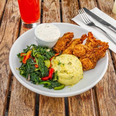 Crispy vegan chicken, with vegetables, mash, and dressing.