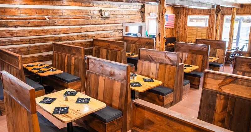 Interior, dining booths with set tables