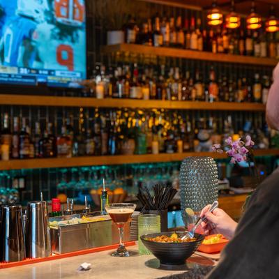 A customer dining at a bar counter.