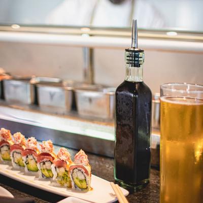 Decorated sushi, glass of beer on the side