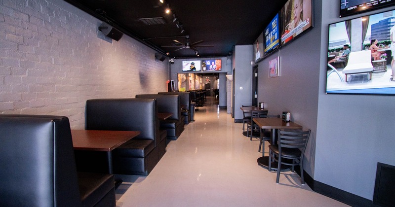 Interior, booths on the left, chairs and tables on the right