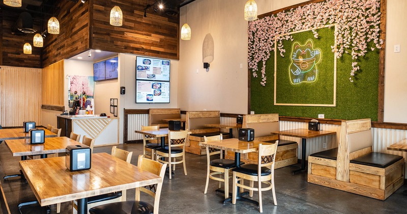 Interior, booths and tables, neon art on the wall