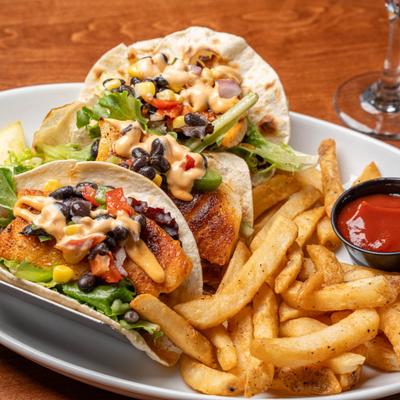 Fish Tacos served with fries and a dip.