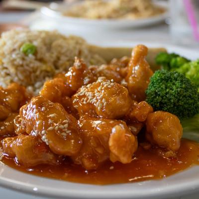 Glazed chicken with rice and broccoli.