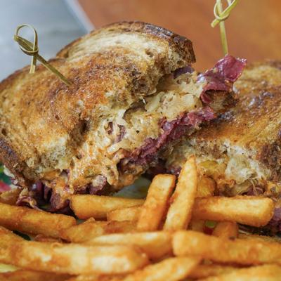 Reuben sandwich with fries.