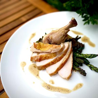 Roasted duck with asparagus.