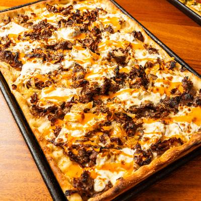 Beef pizza with melted cheese.