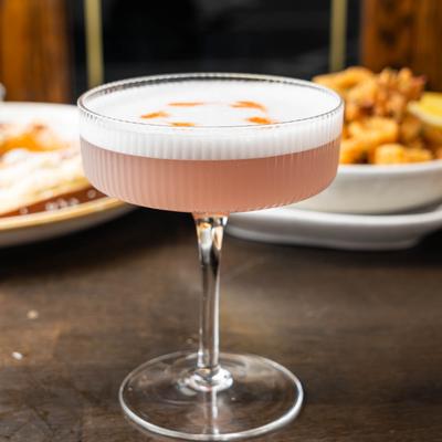 Bees Knees cocktail and food plates.
