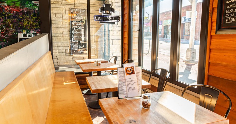Interior, banquette seating with tables and chairs