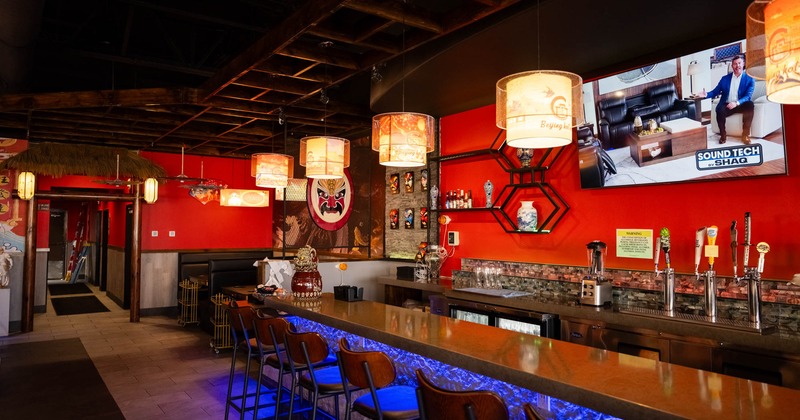 Interior seating space with bar chairs, traditional Chinese decoration