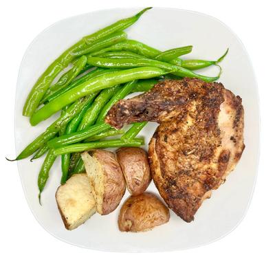 Roasted chicken with potatoes and green beans.