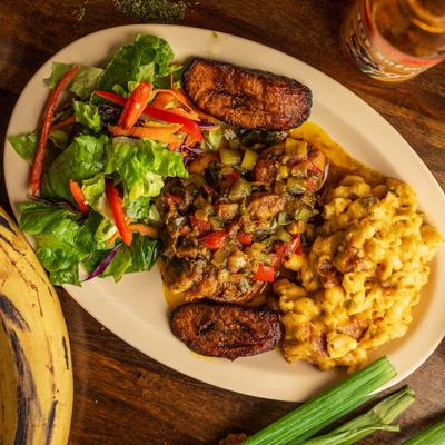 Curry shrimp with plantains, toss salad, and  jalapeno mac and cheese.